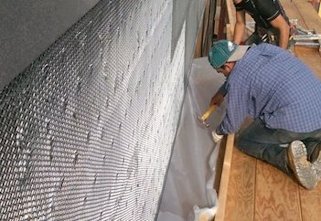 plywood bolted to the concrete with Bituthene