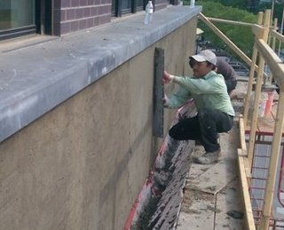 plywood bolted to the concrete with Bituthene