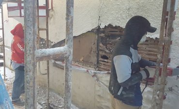 Stucco was stripped off the wood lath