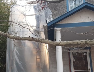 A plastic heat tent allows work to roll and roll on in cold weather