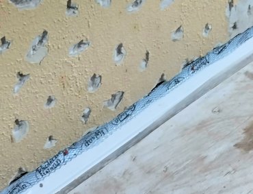 Flashing goes under the stucco