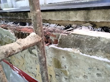 Badly deteriorated planter is re-done.