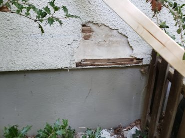 bottom of the pebble dash stucco had been patched several times in Takoma Park.