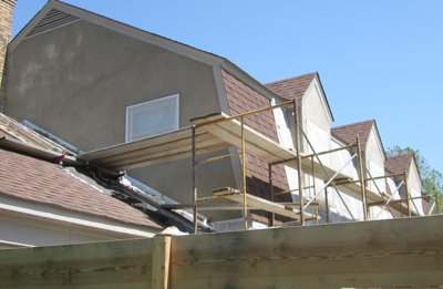 siding off, stucco on in
              Potomac, MD