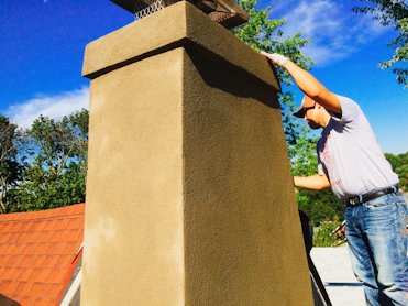 We added a drip band at the top of this stucco chimney