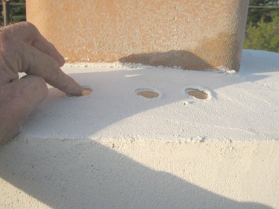Quarters are embedded in the chimney
              cap
