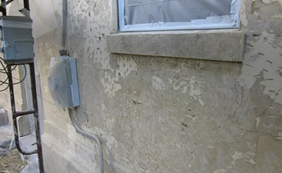 Old wall scraped and chipped