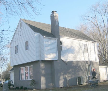 Stucco over
                spalled brick in Manassas, Virginia