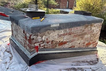 Rubber membrane is covered with metal lath.