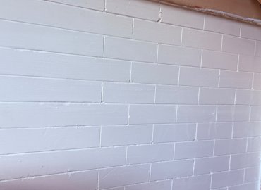 Finish plaster is scored to look like tile.