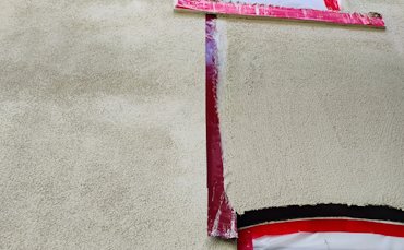 The part just finished is taped off.