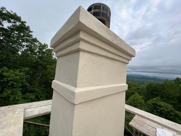 Chimney finished with an off white cement finish.
