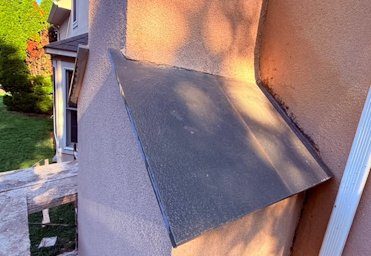 chimney shoulders are covered with our signature flagstone.