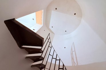 The stair tower is in an old silo.