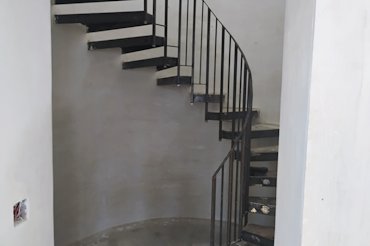 Drywall on curved stairways looks like a ripple potato chip.