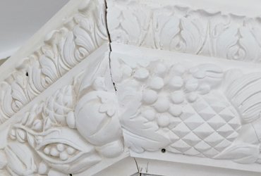 Cast plaster moldings are cut through the fruit and leaves design in Virginia.