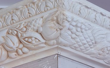 Details are tooled in with molding plaster.