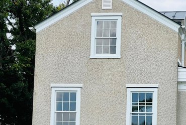 Someone put EIFS basecoat and EIFS finish over painted stucco.