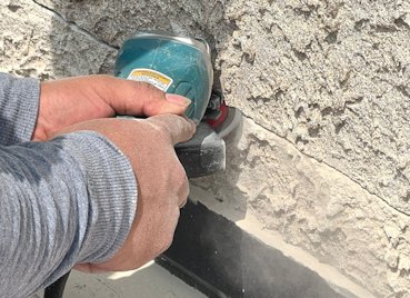 Stucco is cut off above the roof flange