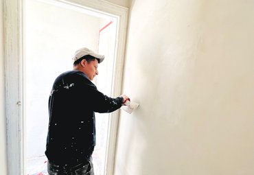 Plaster is troweled smooth.