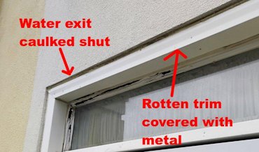 Gap over the door was caulked shut.