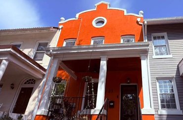 1913 stucco townhouse in Washington, DC.
