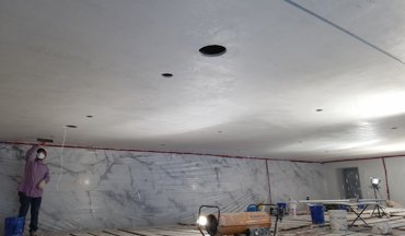 plaster ceiling is troweled shiny and smooth.