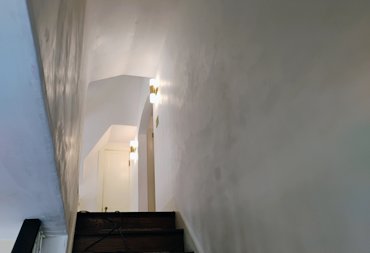 Durable plaster resists abuse in high traffic areas like stairways