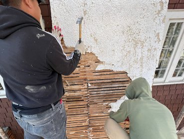 1916 lime and sand stucco was stripped off the wood lath.