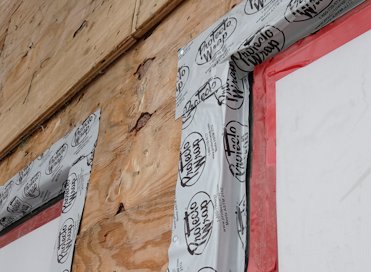 Sides and top of window are sealed with protecto wrap.