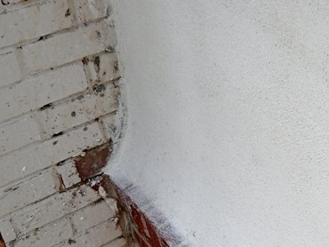 The swoop at the bottom is called a wash in stucco lingo.