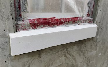 Water runs off the window and is absorbed into the styrofoam, rotting everything behind it.