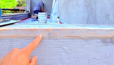  A wood furring strip is nailed on the edge of the balcony.