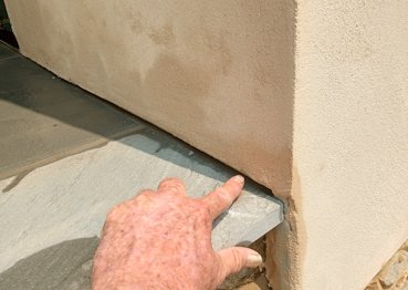 weep holes and a drainage gap.