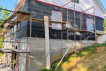 Tyvek is covered with tarpaper.