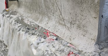  A stucco wash over the stone water table.
