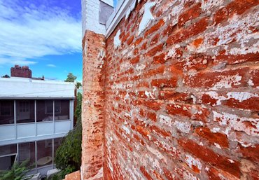 competition stuccoed over painted brick