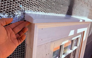 custom made the flashing over the windows on this stucco house in Washington, DC