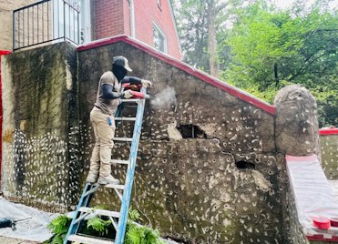 Old stucco chipped and prepared for recoating.