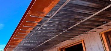 Suspended channel iron for a plaster ceiling in Middleburg, Virginia.