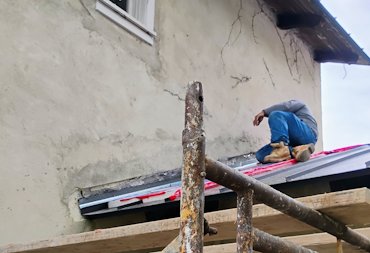 The stucco was cut back so the flashing could go under the stucco