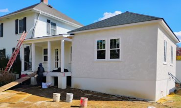 1937 stucco house has a major addition in Warrenton, Virginia