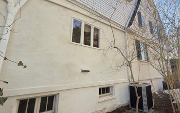 The stucco will be left unpainted.