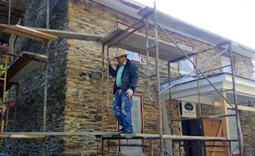 old lime stucco stripped off to the stone..