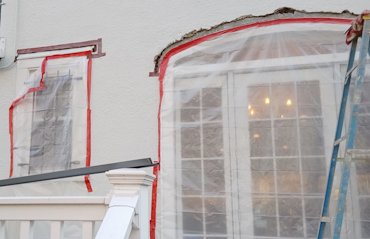 We cut the stucco off above the window to put flashing over the window in Washington, DC.