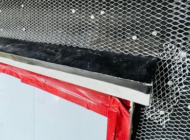 Two layers of tar paper and self furring metal lath.