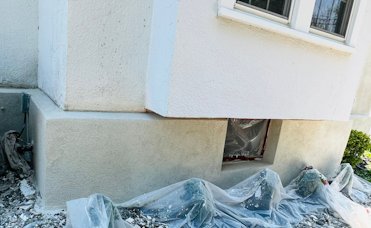 A view of our finished wall. After a basecoat, the finish coat is white portland cement and white
                sand.