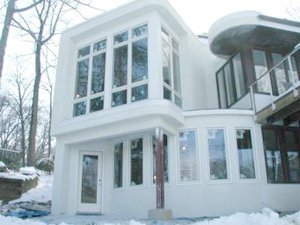 Natural white cement and sand sprayed on this addition in Fairfax, Virginia