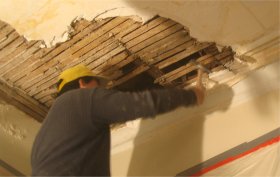 Mouldings and sagging area of ceiling torn out