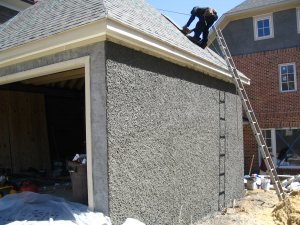 Pebble dash stucco on new house